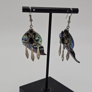 curved abalone dangle earrings with black cabochons and silver tone charms
